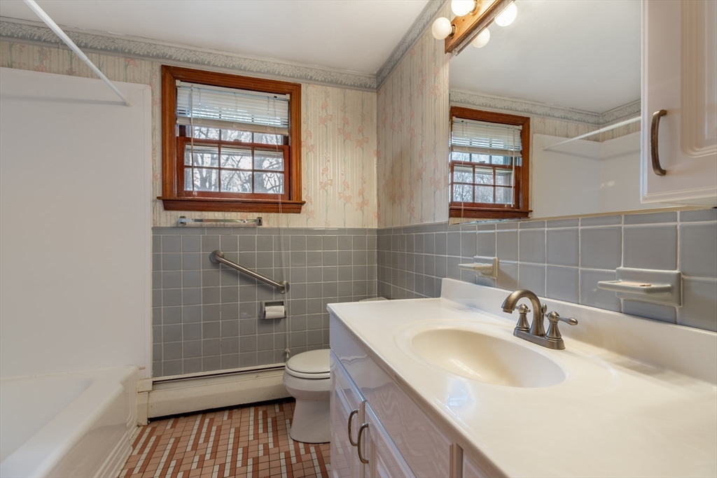 51 Eldred Street Lexington, MA 02420 - Photo 19 of 30 a bathroom with a sink toilet and shower