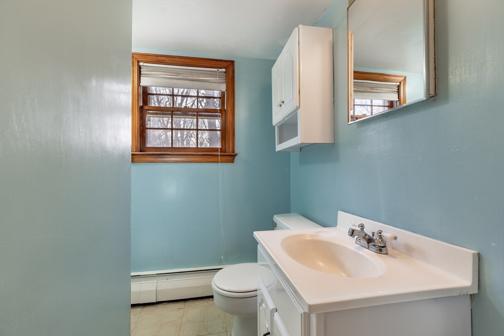 51 Eldred Street Lexington, MA 02420 - Photo 24 of 30 a bathroom with a sink and a toilet