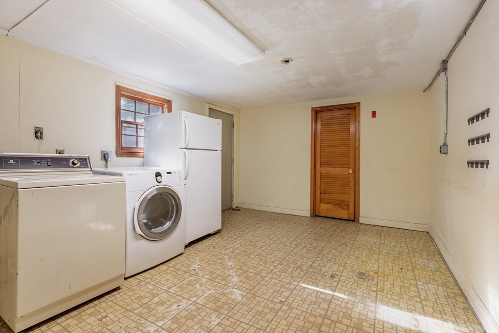 51 Eldred Street Lexington, MA 02420 - Photo 25 of 30 a utility room with dryer and washer