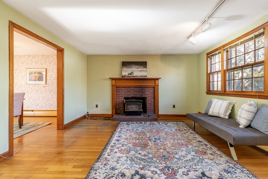 51 Eldred Street Lexington, MA 02420 - Photo 4 of 30 a living room with furniture and a fireplace