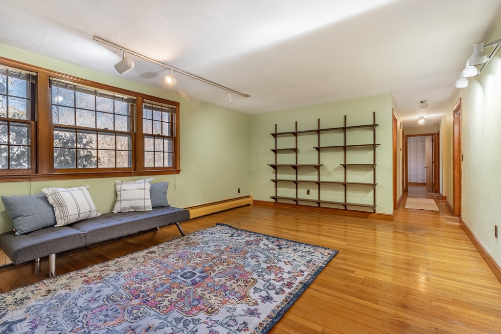 51 Eldred Street Lexington, MA 02420 - Photo 7 of 30 a living room with a couch and a rug