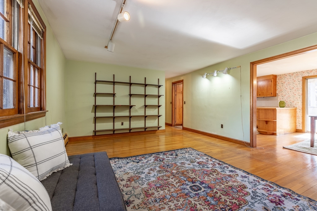 51 Eldred Street Lexington, MA 02420 - Photo 8 of 30 a view of a livingroom with furniture and an entryway