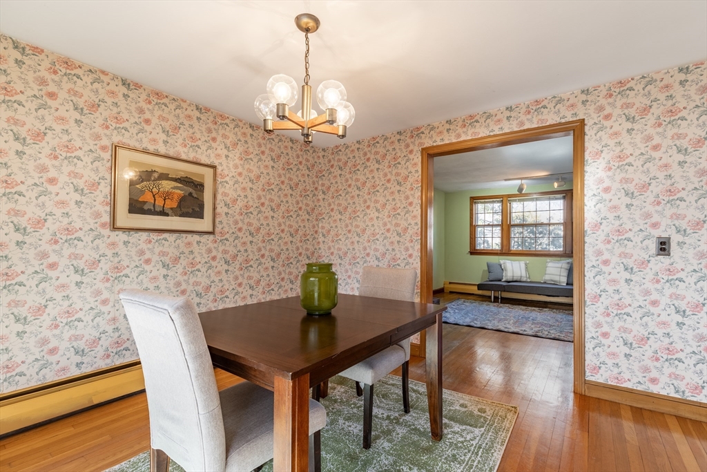 51 Eldred Street Lexington, MA 02420 - Photo 9 of 30 a view of a dining room with furniture and wooden floor