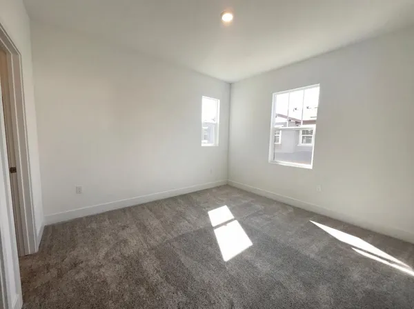 an empty room with windows