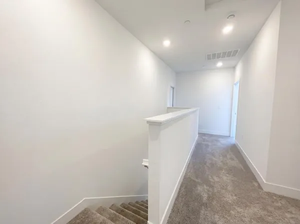 a view of hallway with stairs