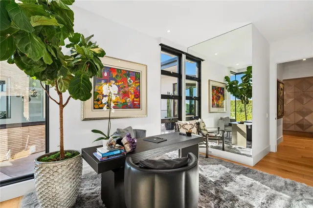 a view of a kitchen with cabinets and wooden floor