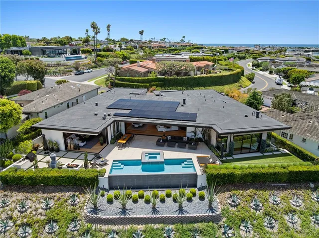 a view of a house with yard and sitting area