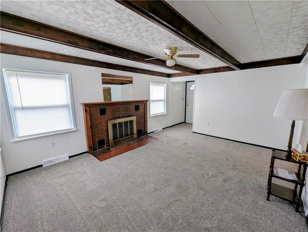 165 Saxonburg Road Butler, PA 16002 - Photo 6 of 44 a view of an empty room with a fireplace