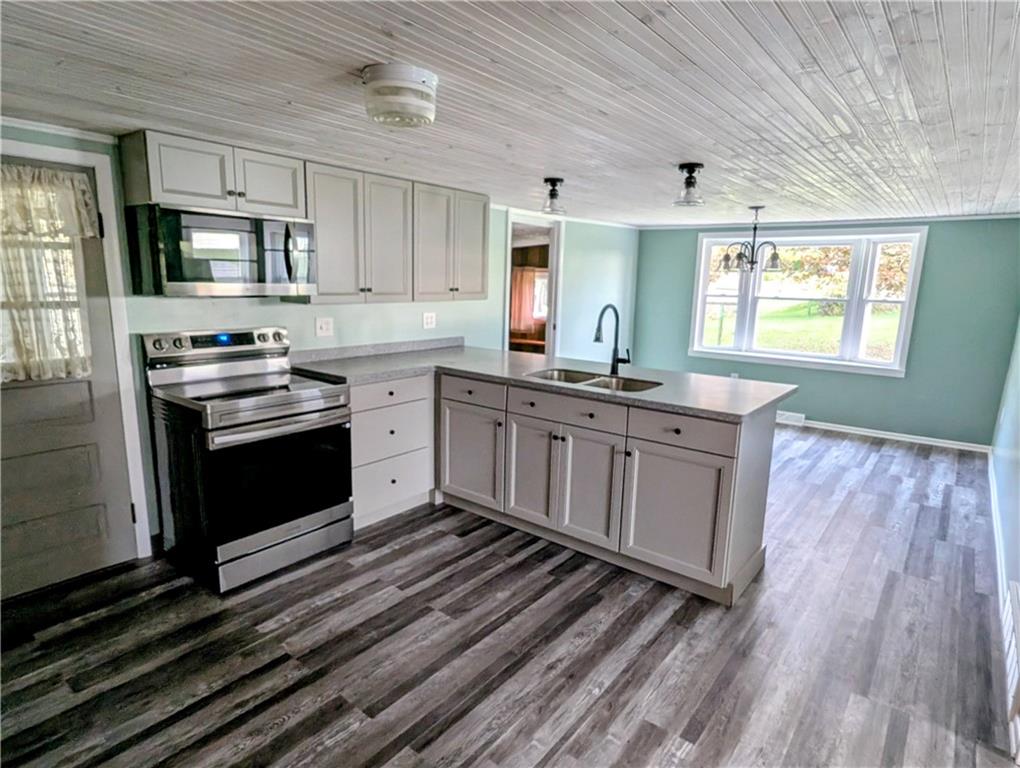 165 Saxonburg Road Butler, PA 16002 - Photo 8 of 44 a kitchen with stainless steel appliances granite countertop a stove a sink and a refrigerator