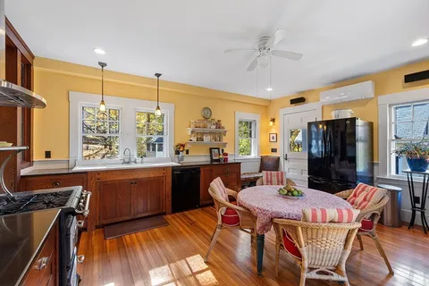 a dining room with furniture window wooden floor
