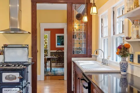 a view of an entryway with wooden floor