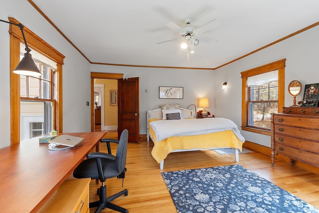 4 Bolton Road Harvard, MA 01451 - Photo 24 of 42 a bedroom with a bed and wooden floor
