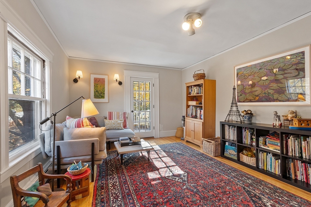 4 Bolton Road Harvard, MA 01451 - Photo 25 of 42 a living room with furniture and a book shelf