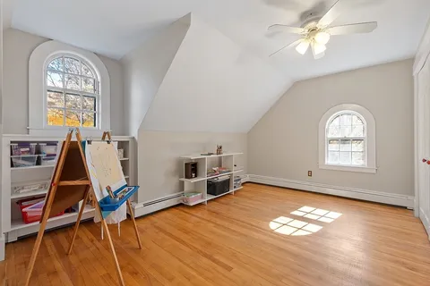 a bedroom with furniture and a chandelier