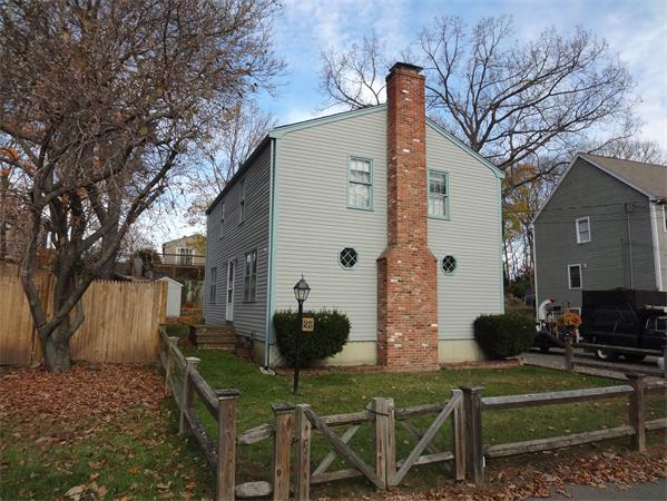 25 Bennett Road Marblehead, MA 01945 - Photo 1 of 15 a view of a house with backyard and sitting area