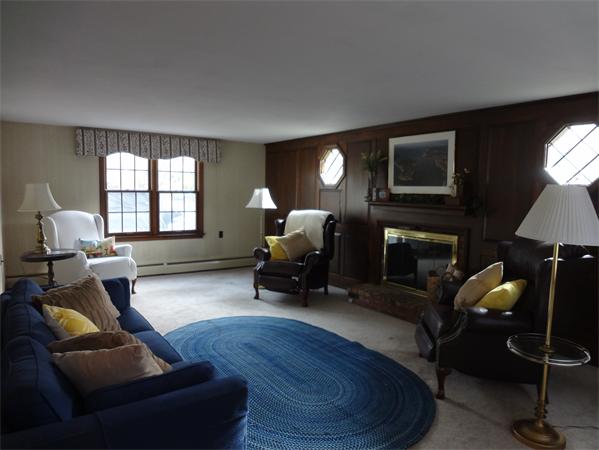 25 Bennett Road Marblehead, MA 01945 - Photo 3 of 15 a living room with furniture and a fireplace