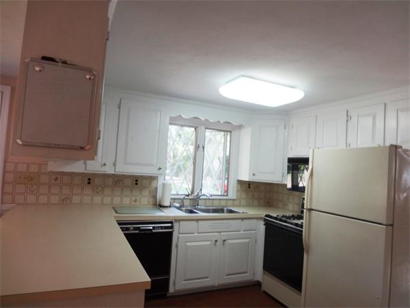 25 Bennett Road Marblehead, MA 01945 - Photo 5 of 15 a kitchen with a refrigerator stove and sink