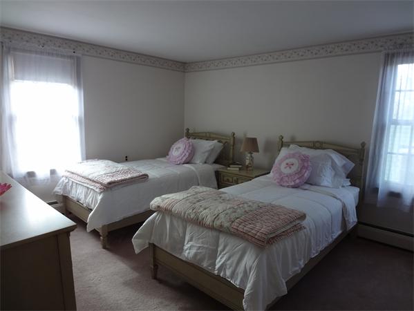 25 Bennett Road Marblehead, MA 01945 - Photo 8 of 15 a bedroom with two beds and window