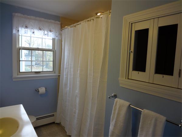25 Bennett Road Marblehead, MA 01945 - Photo 10 of 15 a bathroom with a sink toilet and shower