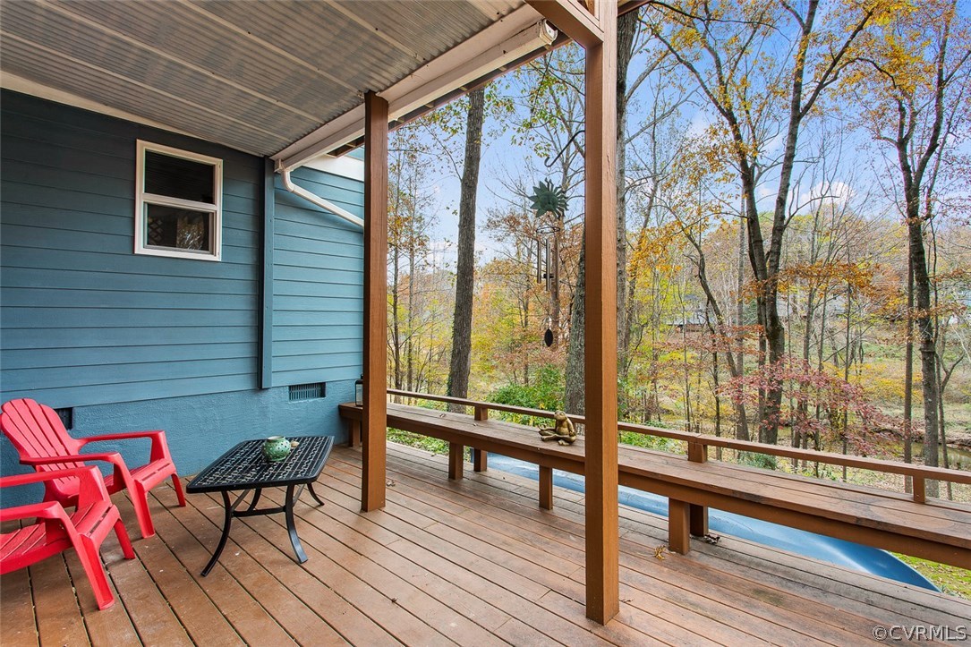 1413 Sycamore Ridge Court Midlothian, VA 23114 - Photo 33 of 36 Lower deck with built-in bench overlooking the bea