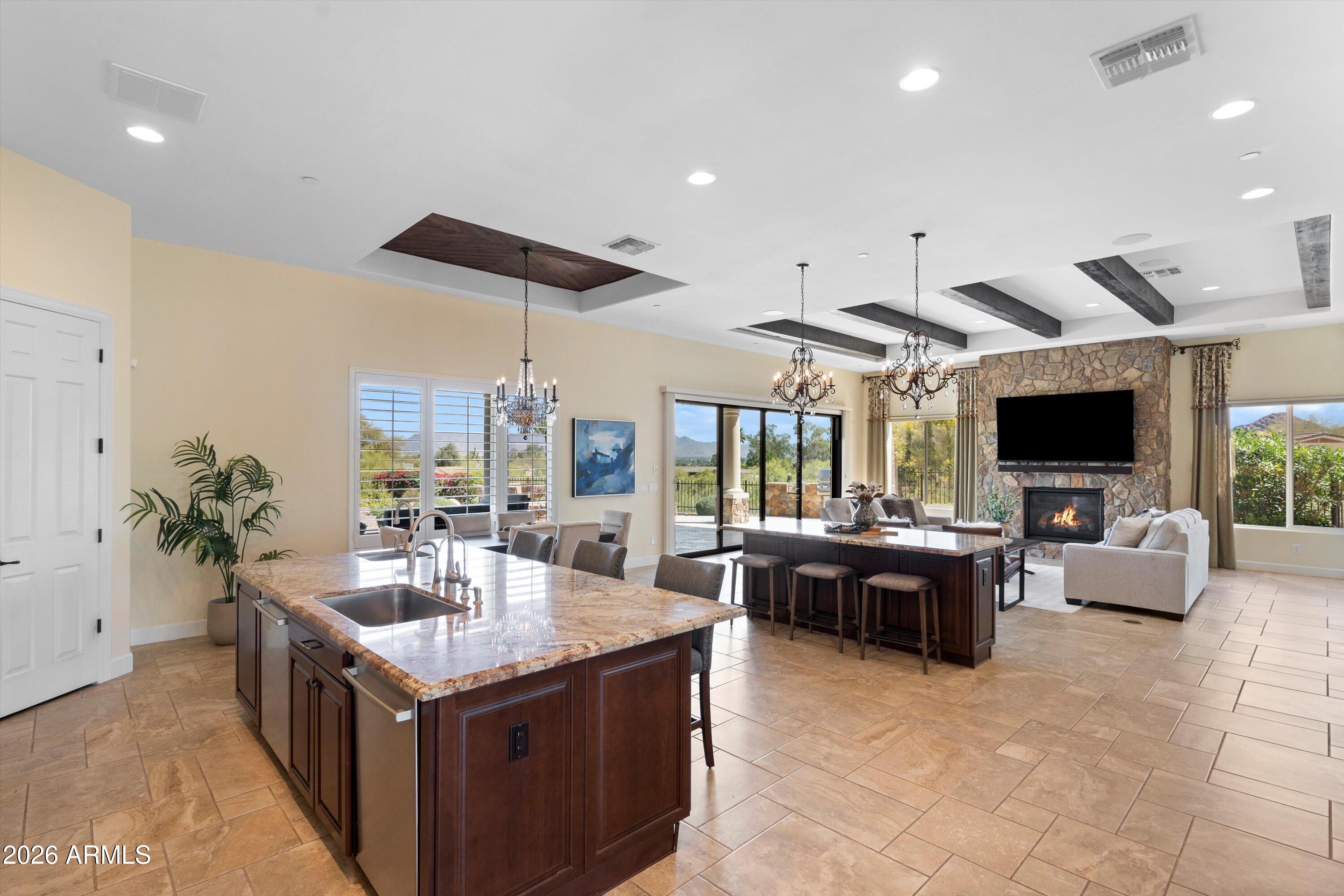 4602 East Mockingbird Lane Phoenix, AZ 85028 - Photo 9 of 41 a view of living room kitchen with furniture and flat screen tv