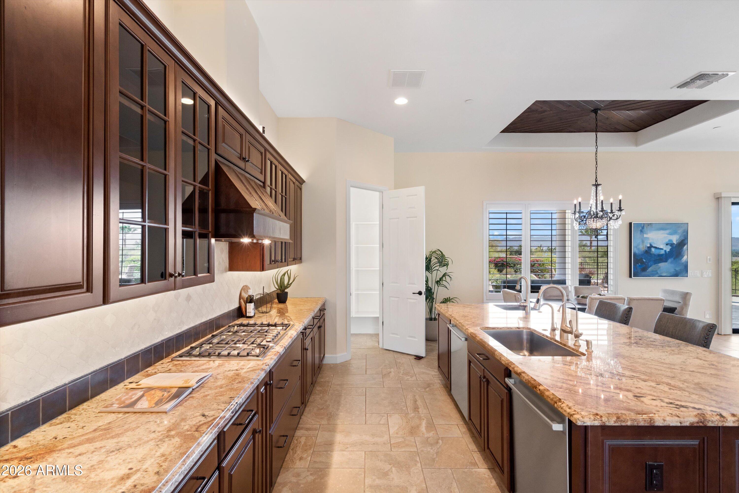 4602 East Mockingbird Lane Phoenix, AZ 85028 - Photo 10 of 41 a large kitchen with a large counter top and sink