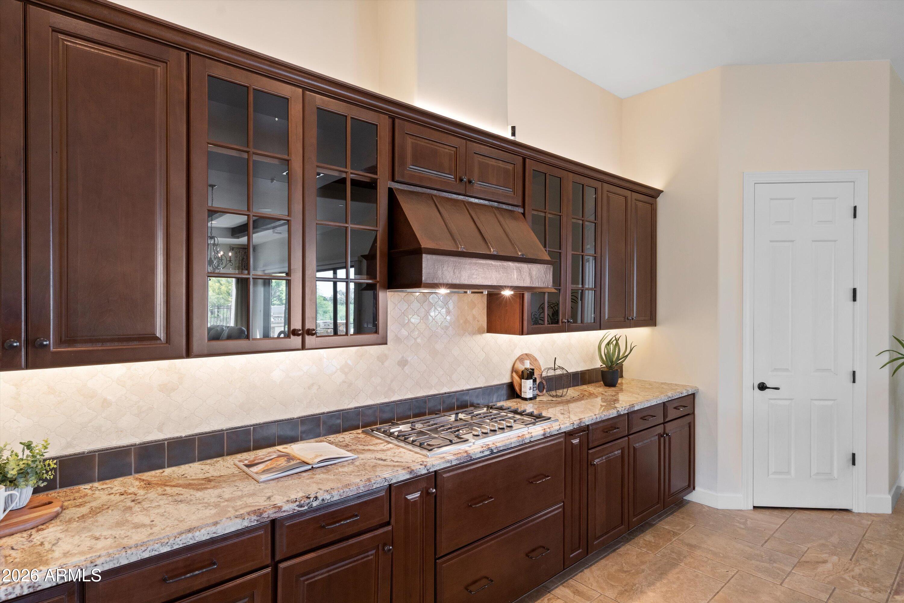 4602 East Mockingbird Lane Phoenix, AZ 85028 - Photo 14 of 41 a kitchen with granite countertop a stove and a sink