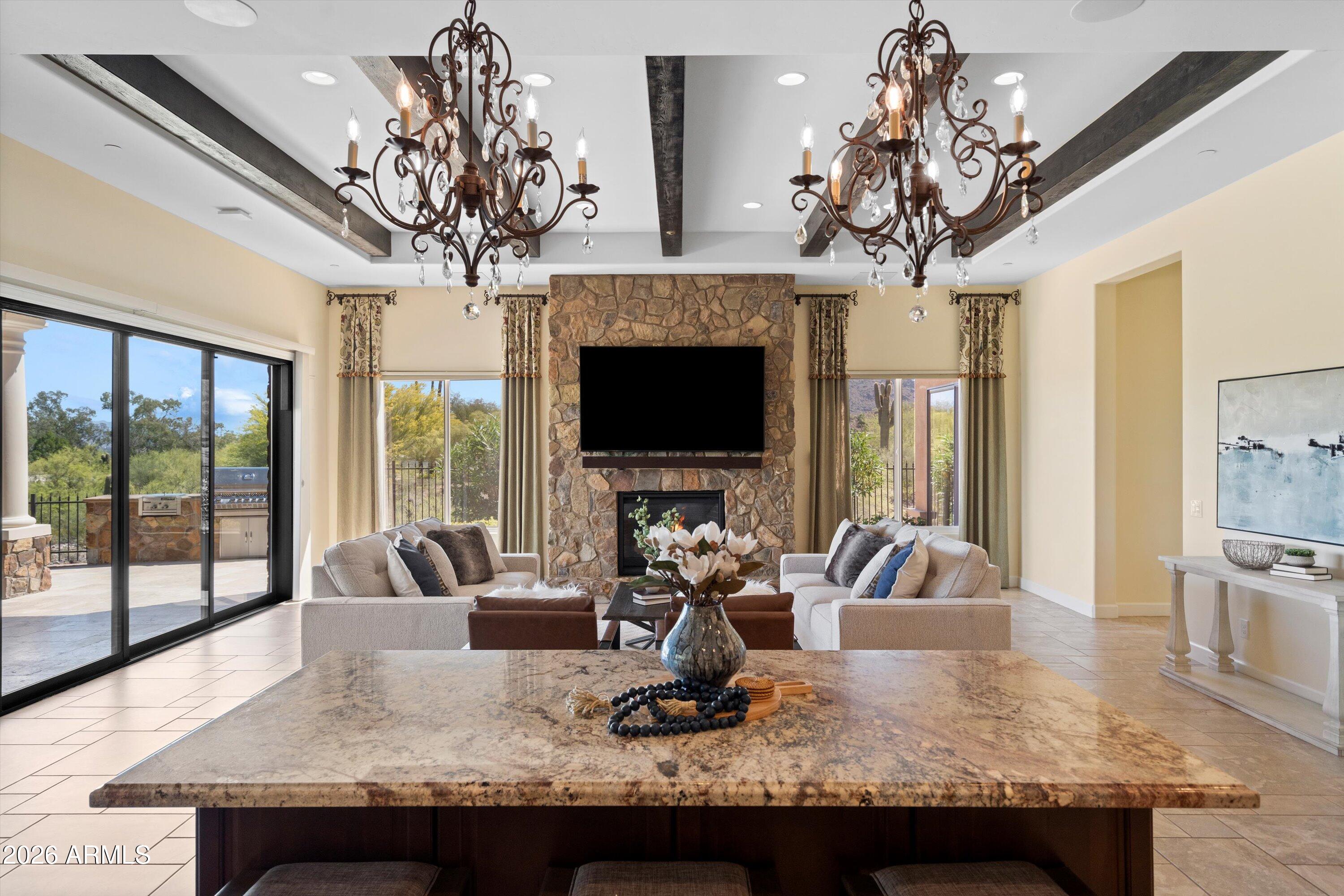 4602 East Mockingbird Lane Phoenix, AZ 85028 - Photo 15 of 41 a view of a dining room with furniture wooden floor and chandelier
