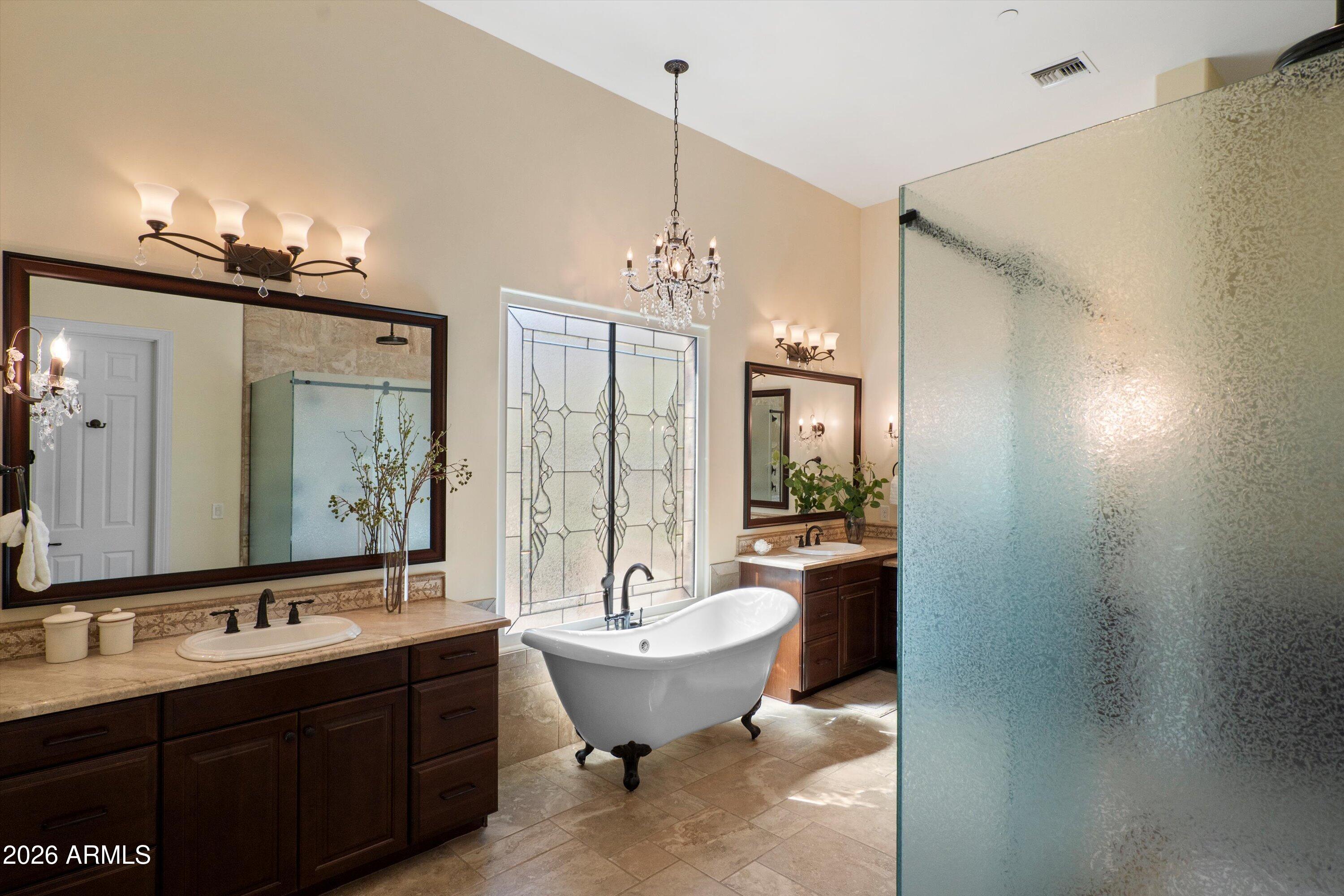4602 East Mockingbird Lane Phoenix, AZ 85028 - Photo 20 of 41 a bathroom with a double vanity sink mirror and bathtub