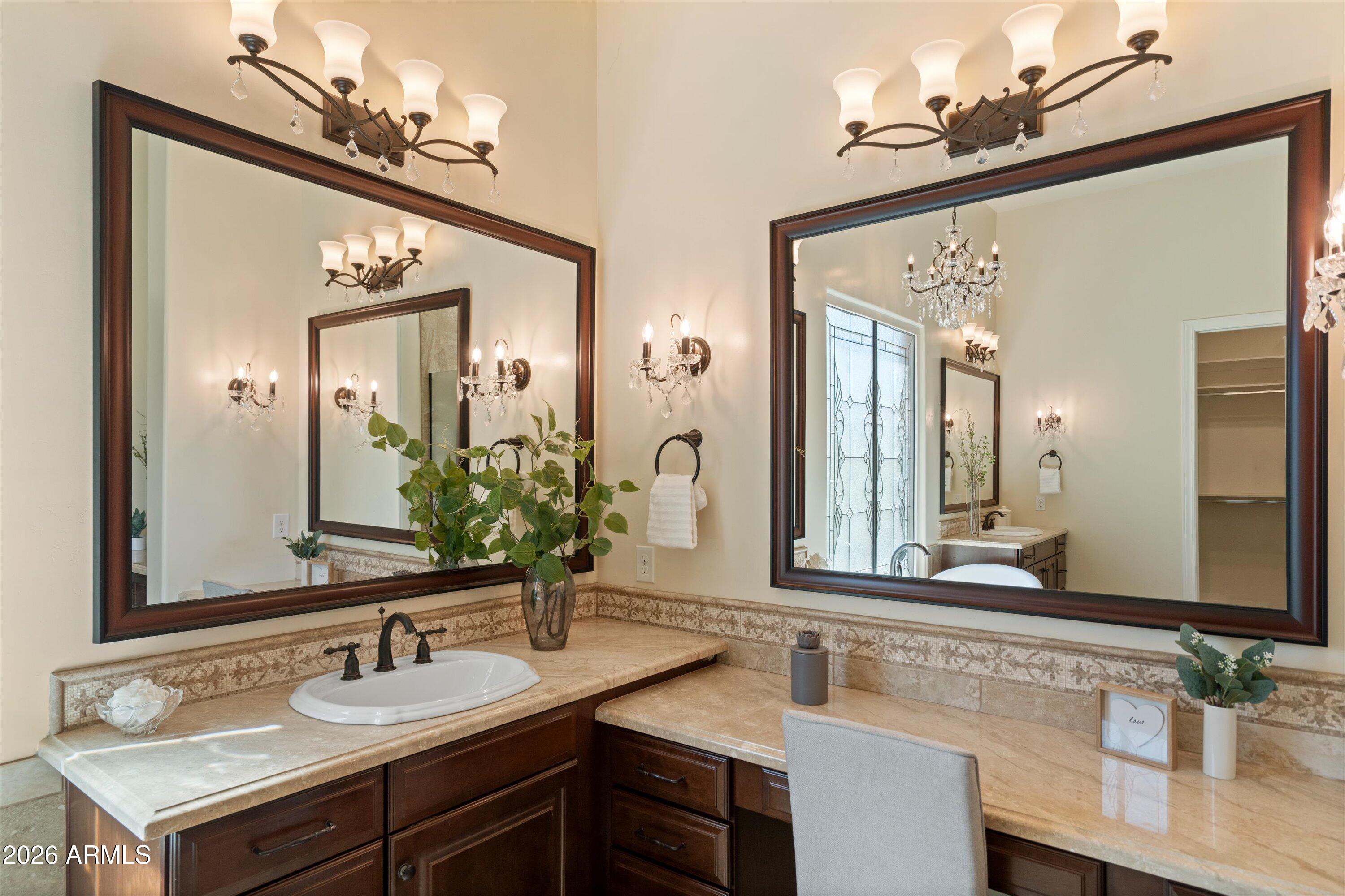 4602 East Mockingbird Lane Phoenix, AZ 85028 - Photo 21 of 41 a bathroom with a sink and a mirror