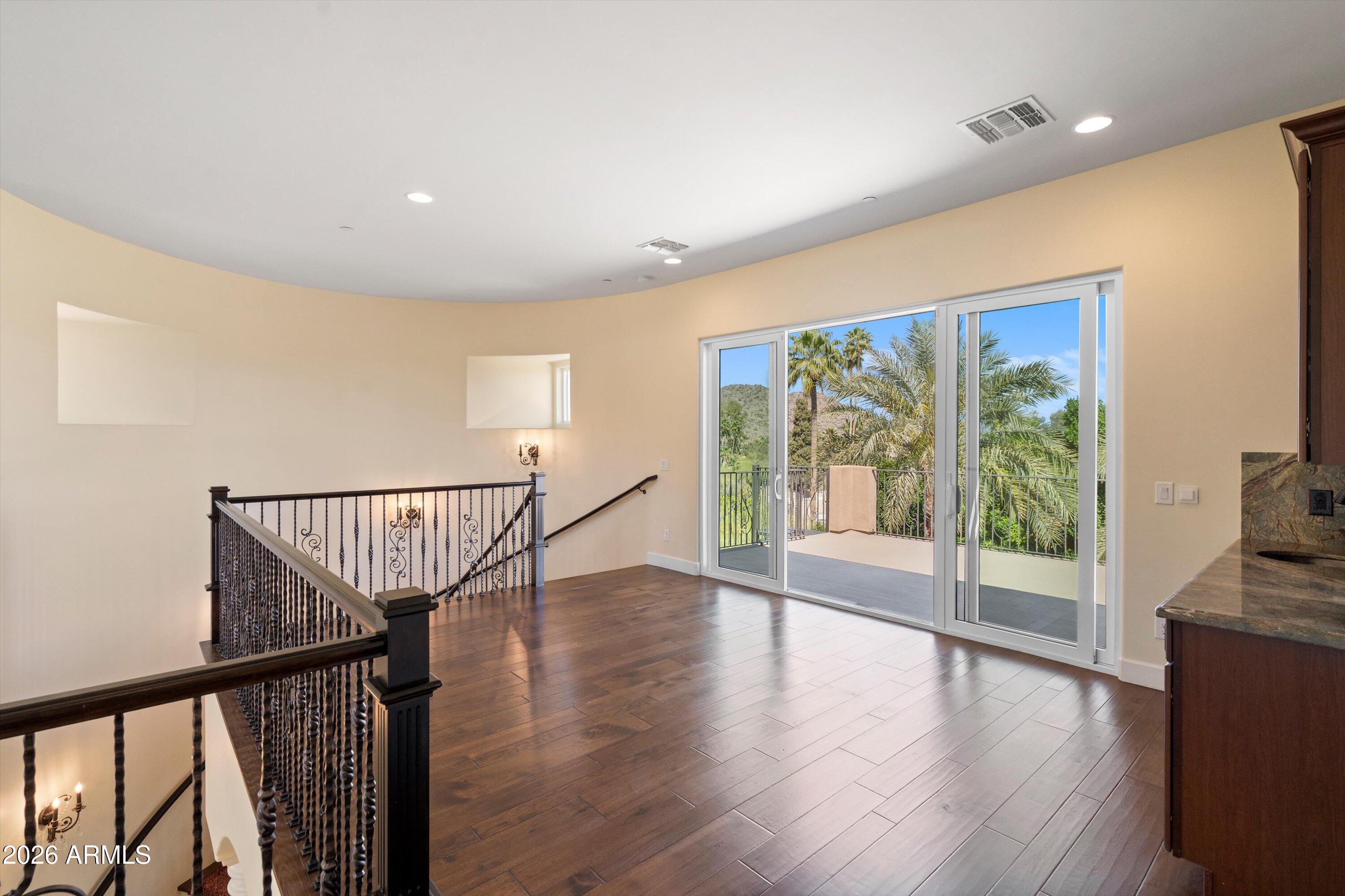 4602 East Mockingbird Lane Phoenix, AZ 85028 - Photo 28 of 41 a view of an entryway with wooden floor and door