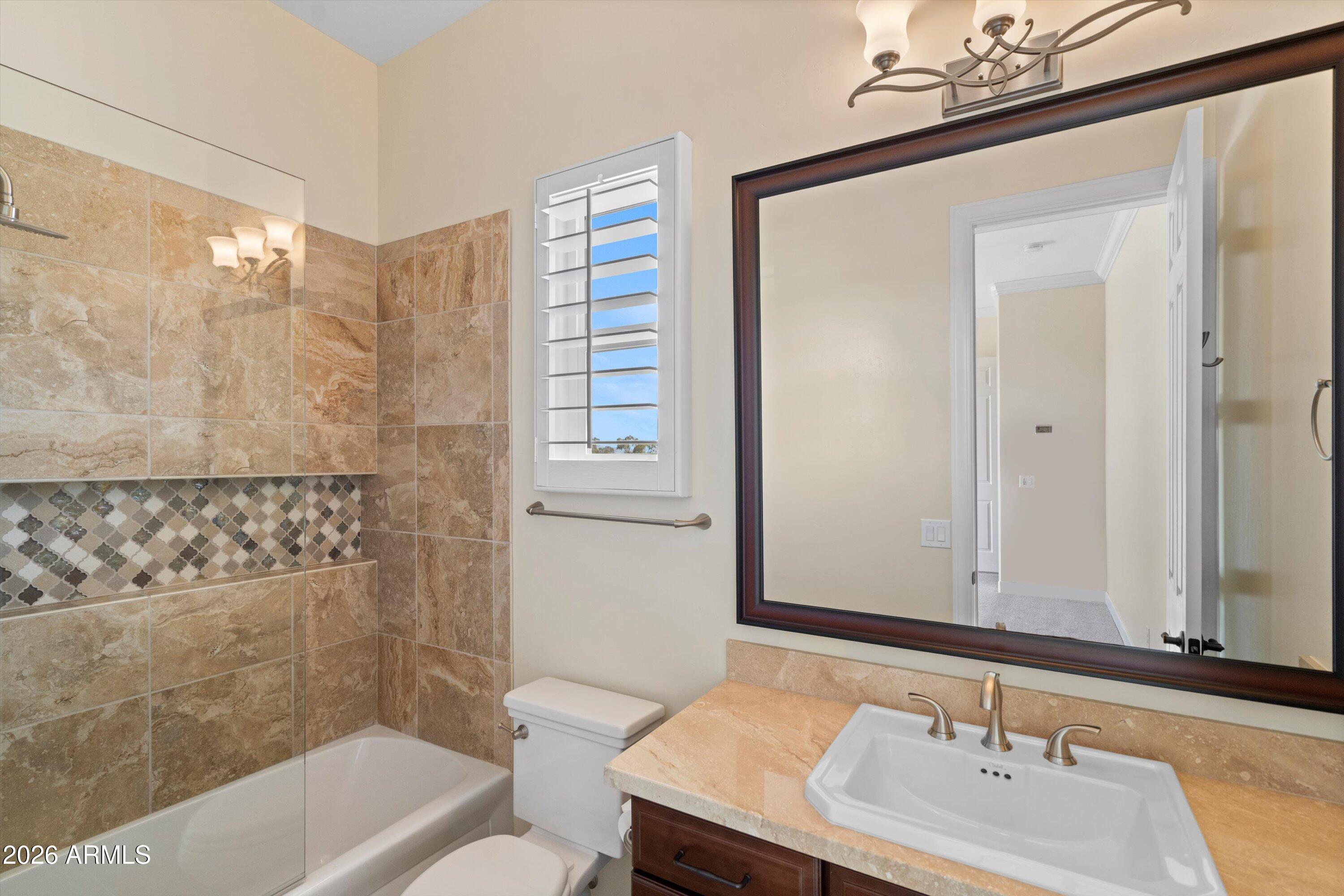 4602 East Mockingbird Lane Phoenix, AZ 85028 - Photo 33 of 41 a bathroom with a sink a toilet and shower