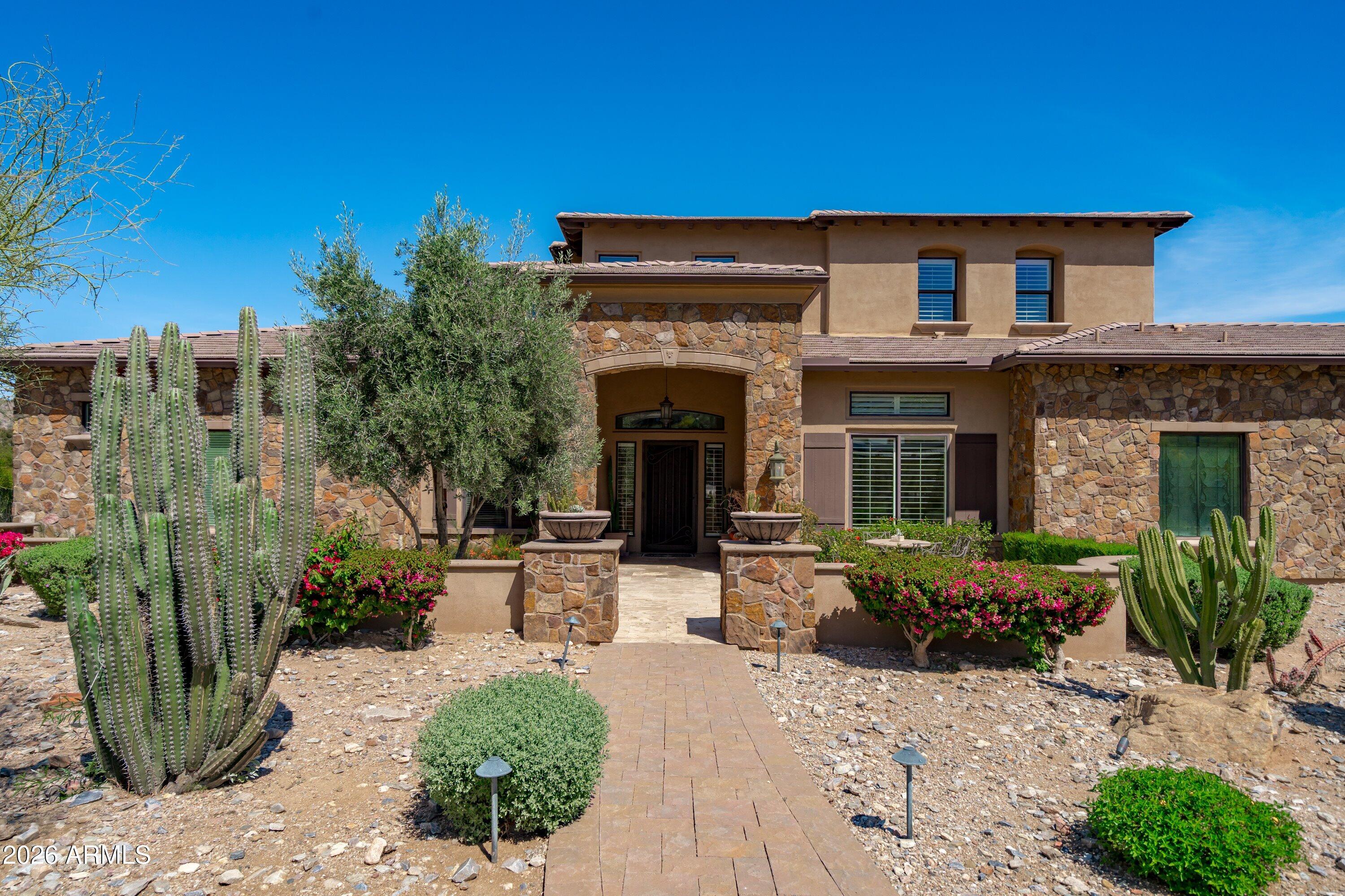 4602 East Mockingbird Lane Phoenix, AZ 85028 - Photo 3 of 41 a view of a house with potted plants