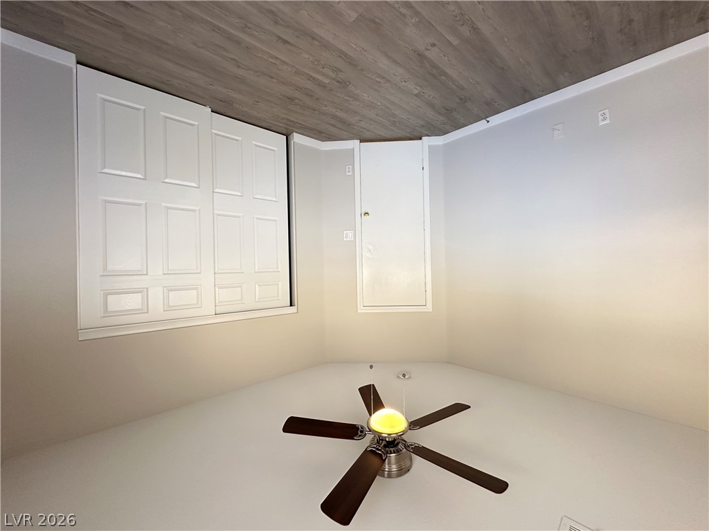 10191 Splendor Ridge Avenue Las Vegas, NV 89135 - Photo 18 of 31 Hardwood-style flooring extends into this space with convenient access points and a ceiling fan.