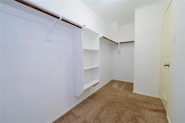 a view of an empty walk in closet