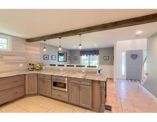 21 Indian Ridge Road Stow, MA 01775 - Photo 11 of 30 a kitchen with stainless steel appliances granite countertop a sink and cabinets