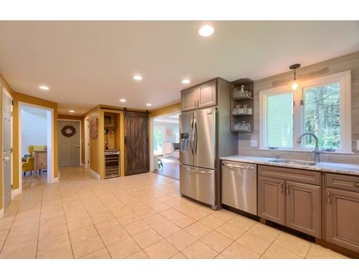 21 Indian Ridge Road Stow, MA 01775 - Photo 12 of 30 a kitchen with stainless steel appliances granite countertop a refrigerator and a sink