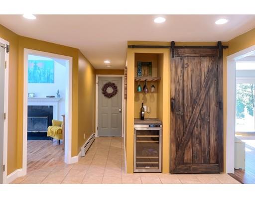 21 Indian Ridge Road Stow, MA 01775 - Photo 13 of 30 a view of a hallway with wooden floor and furniture