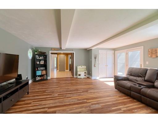 21 Indian Ridge Road Stow, MA 01775 - Photo 15 of 30 a living room with furniture and a flat screen tv
