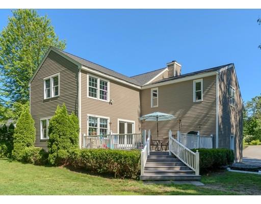 21 Indian Ridge Road Stow, MA 01775 - Photo 2 of 30 a front view of a house with a yard