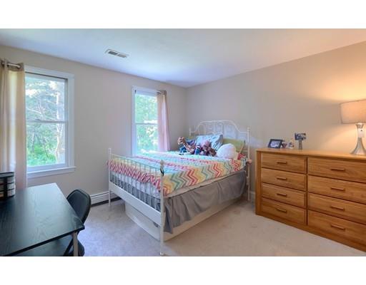 21 Indian Ridge Road Stow, MA 01775 - Photo 21 of 30 a bedroom with a bed window and a couch