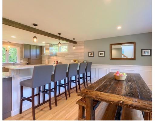 21 Indian Ridge Road Stow, MA 01775 - Photo 7 of 30 a kitchen with stainless steel appliances dining table and chairs