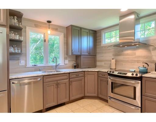 21 Indian Ridge Road Stow, MA 01775 - Photo 9 of 30 a kitchen with a stove a sink and a window