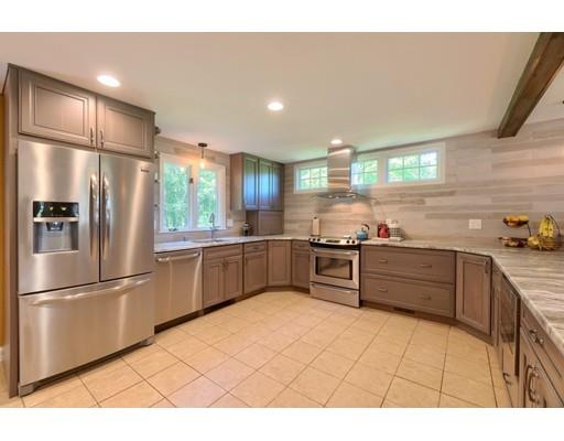 21 Indian Ridge Road Stow, MA 01775 - Photo 10 of 30 a kitchen with stainless steel appliances a refrigerator sink and cabinets
