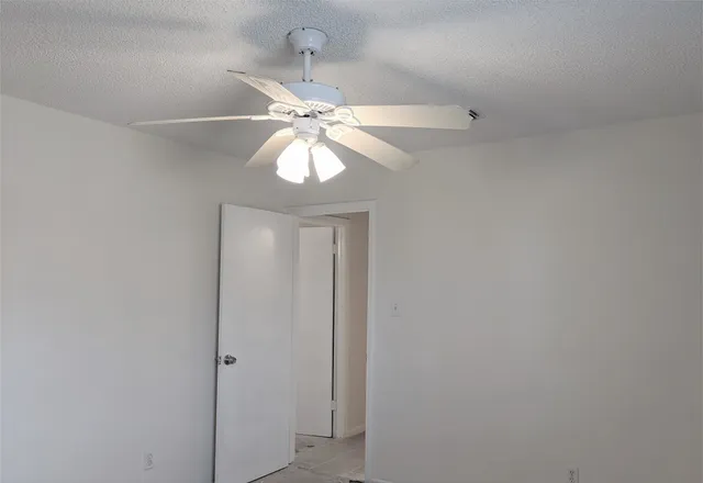 an view of a chandelier fan in a room