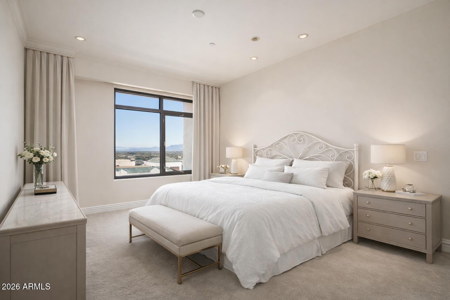 7181 East Camelback Road, Unit 1202 Scottsdale, AZ 85251 - Photo 34 of 47 a bedroom with a bed and a couch