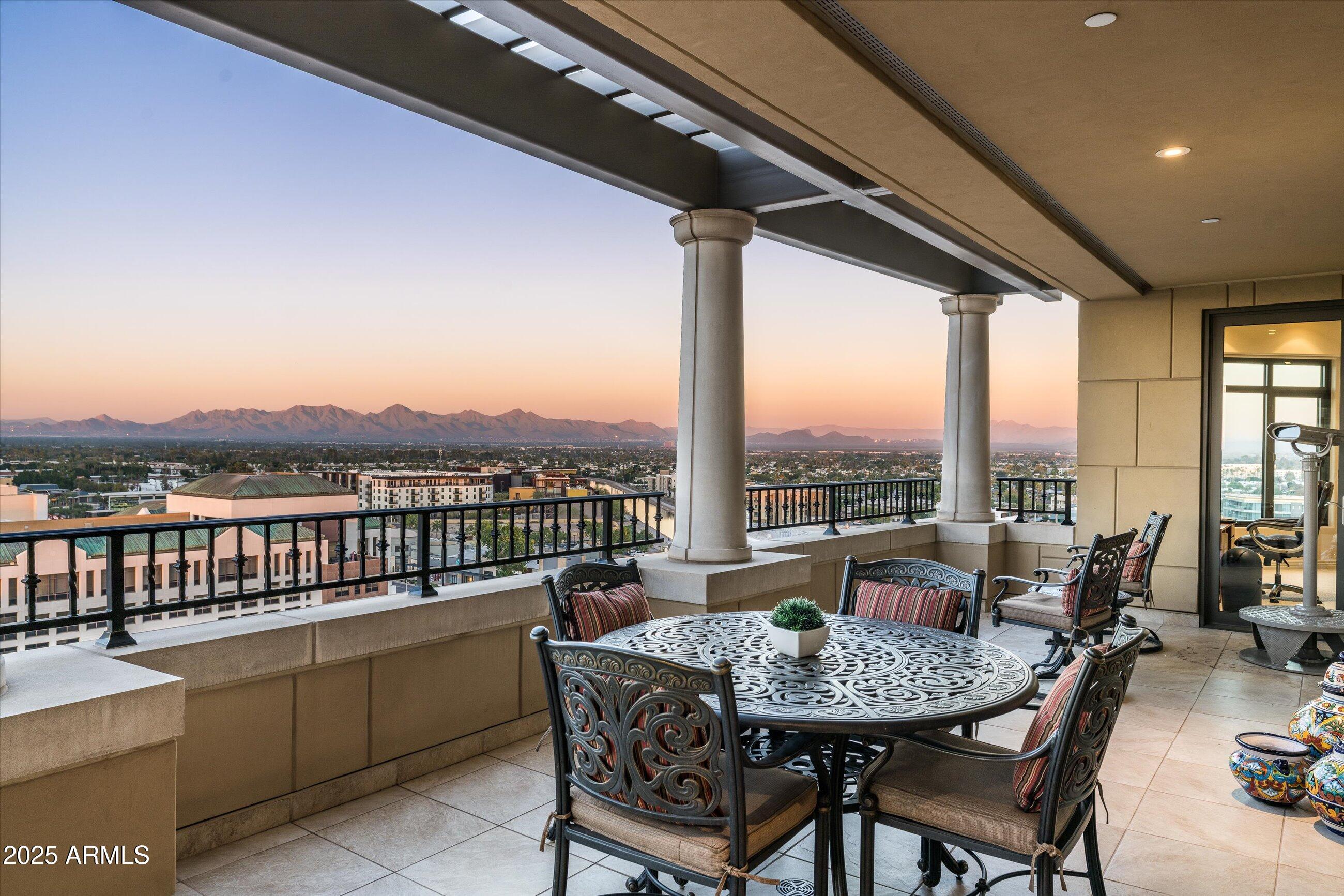 7181 East Camelback Road, Unit 1202 Scottsdale, AZ 85251 - Photo 36 of 47 a view of a balcony with furniture and a garden
