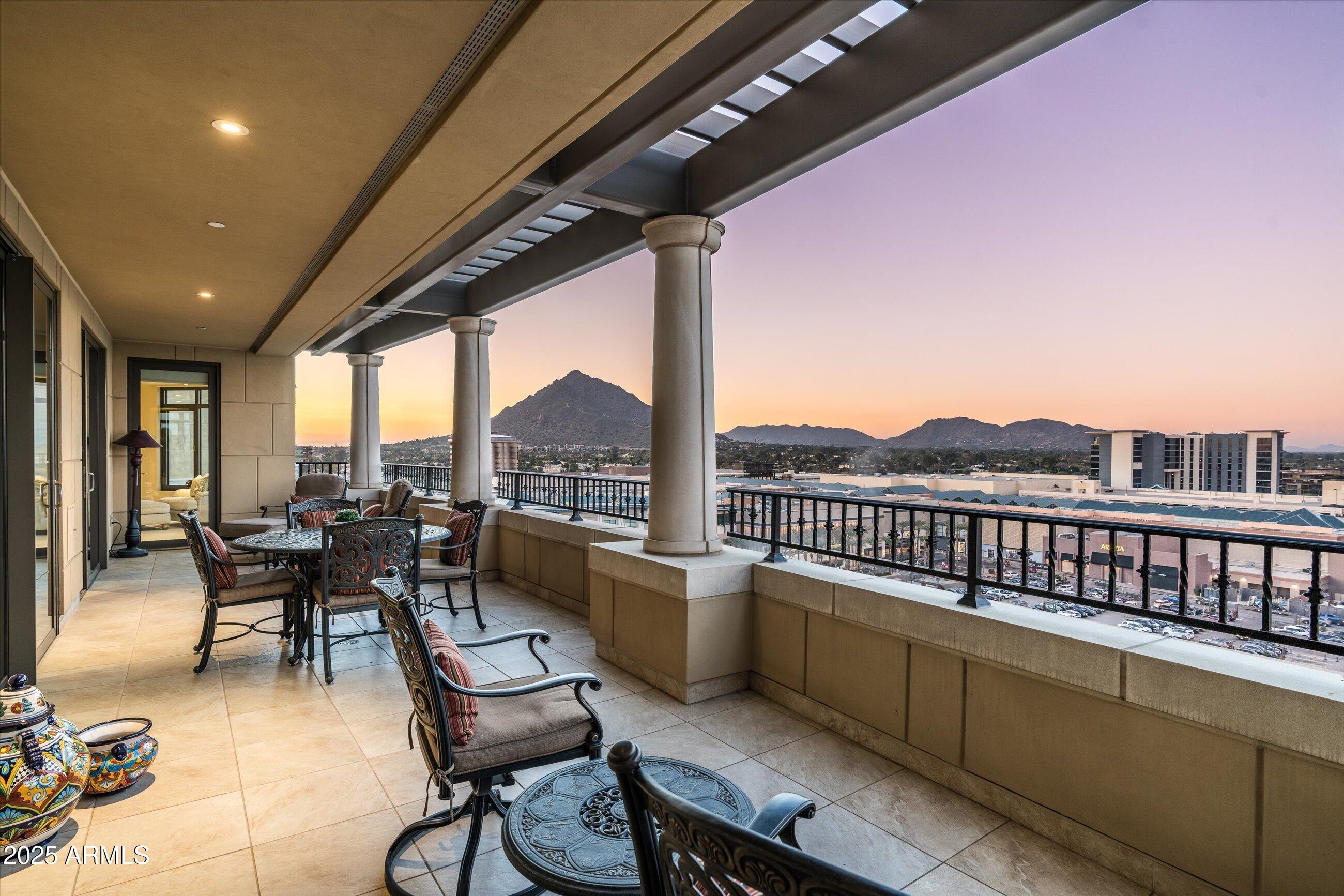 7181 East Camelback Road, Unit 1202 Scottsdale, AZ 85251 - Photo 41 of 47 a view of a chairs and table in the balcony