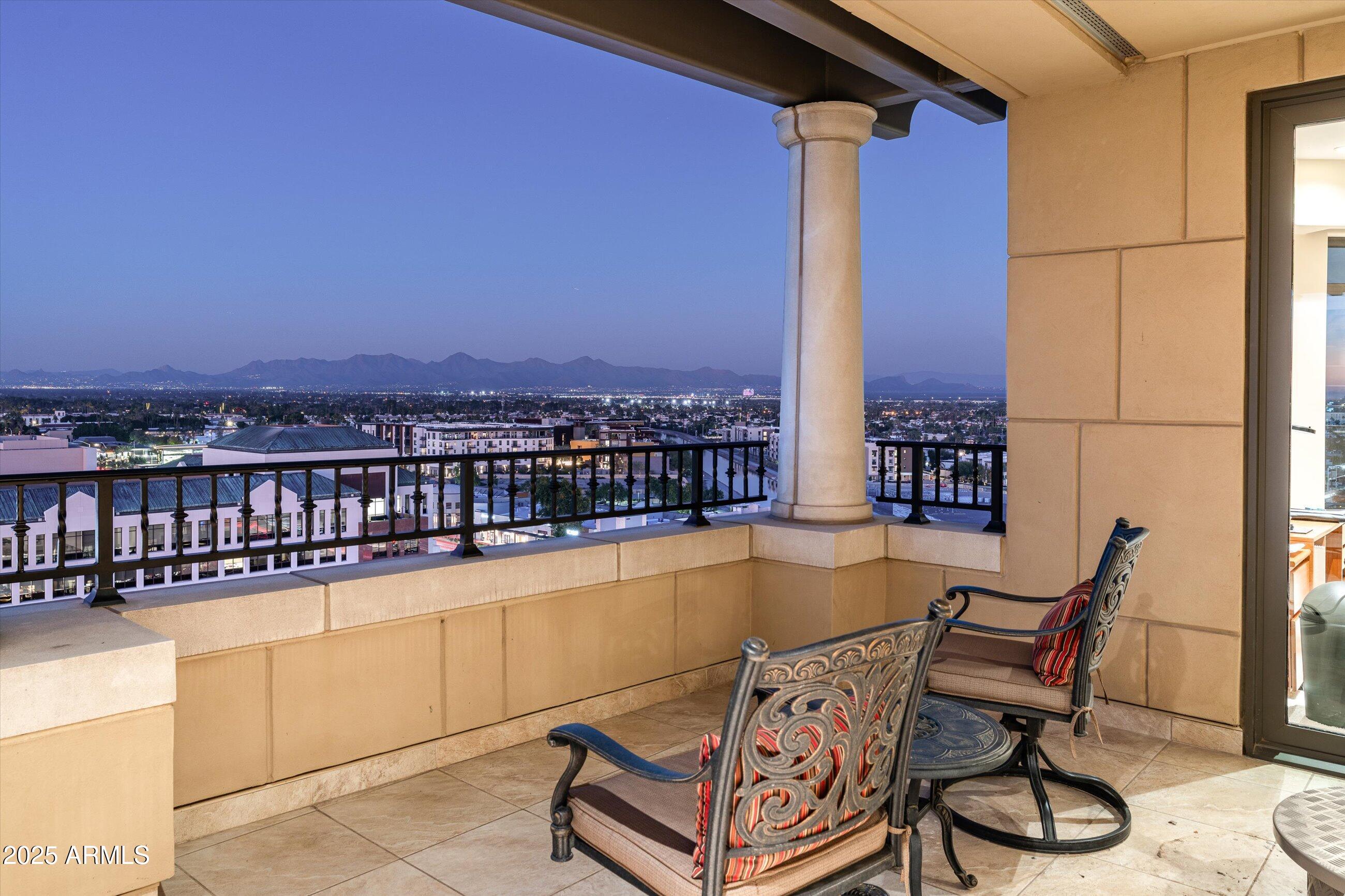 7181 East Camelback Road, Unit 1202 Scottsdale, AZ 85251 - Photo 43 of 47 a view of a chairs and table in the terrace