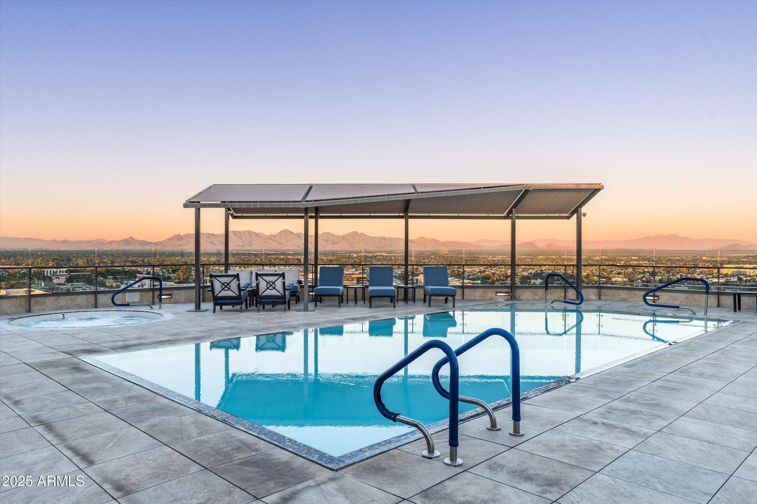 7181 East Camelback Road, Unit 1202 Scottsdale, AZ 85251 - Photo 46 of 47 a view of a swimming pool with a lounge chair